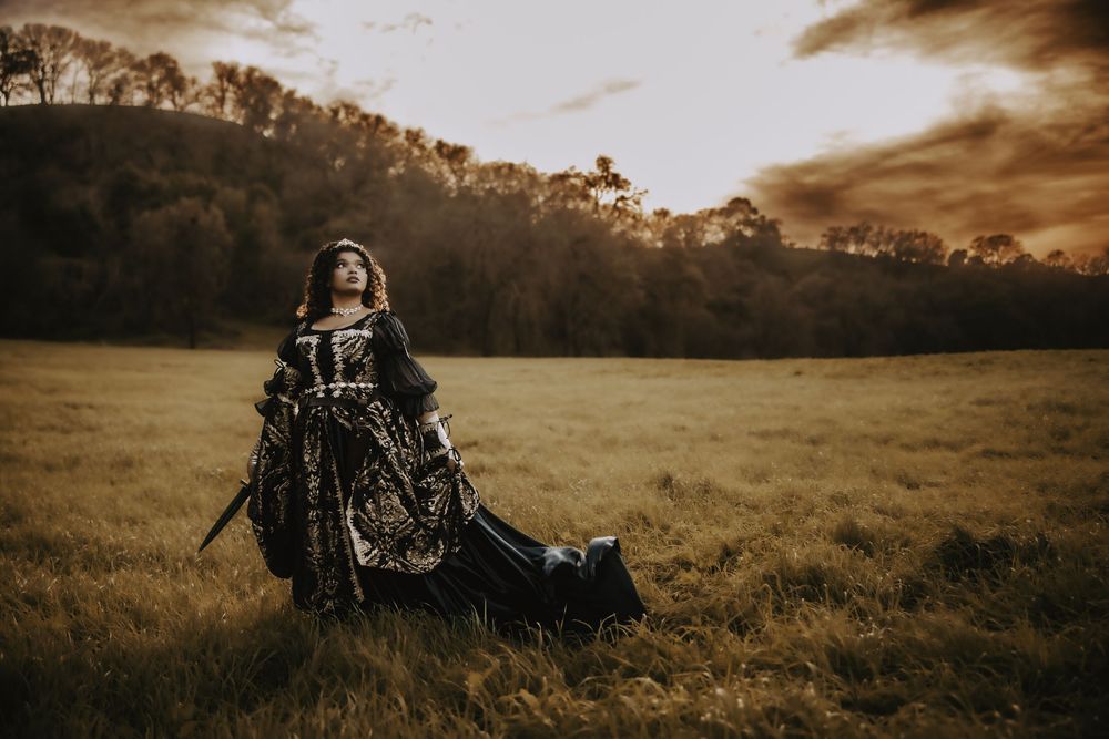 A dramatic sepia-toned panoramic sequence shows a person walking through a misty meadow at sunset.