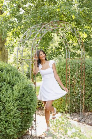 Warm Iowa summer senior photo session in Des Moines rose garden.