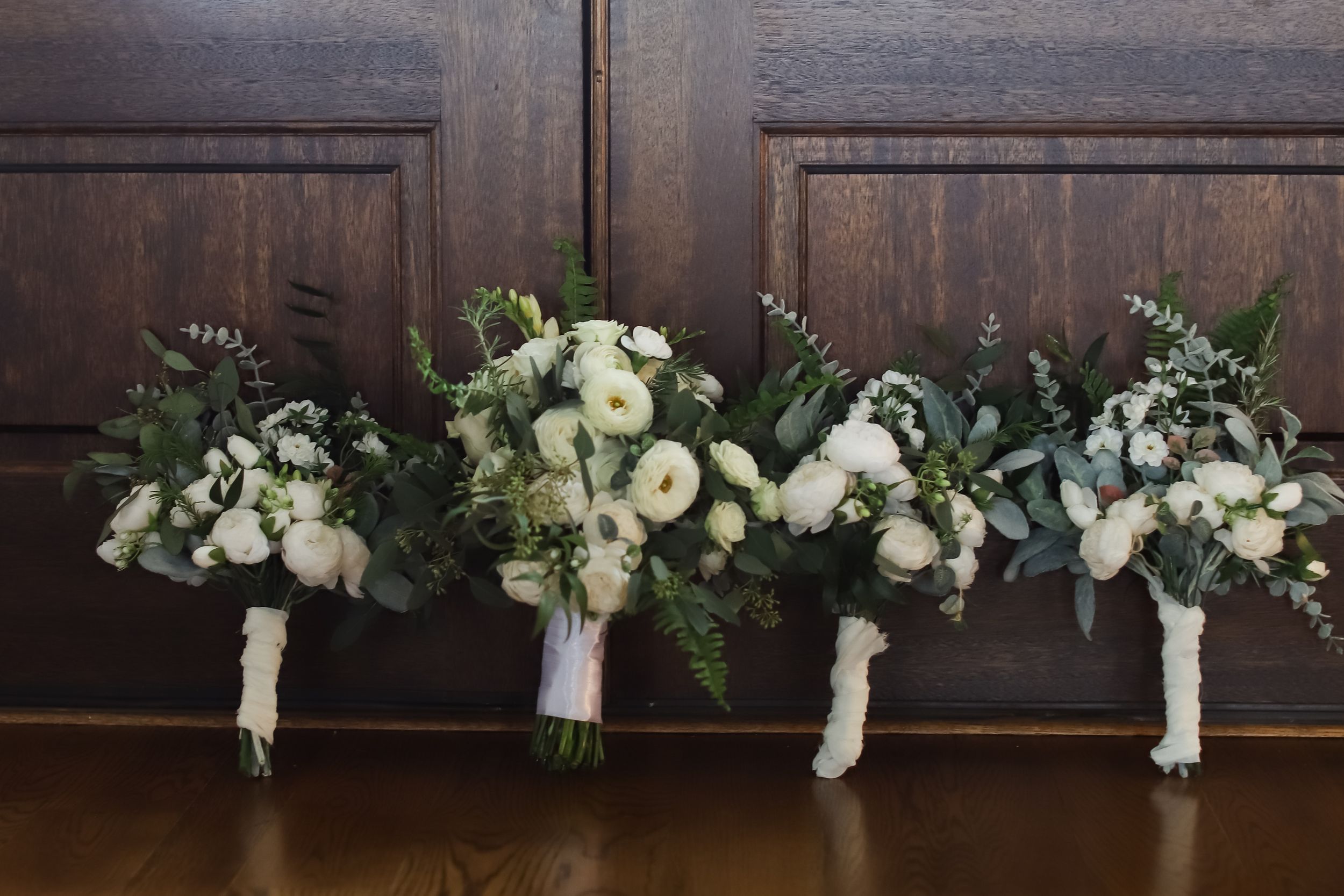 creative and unique shot of bridal bouquets and bridesmaids
