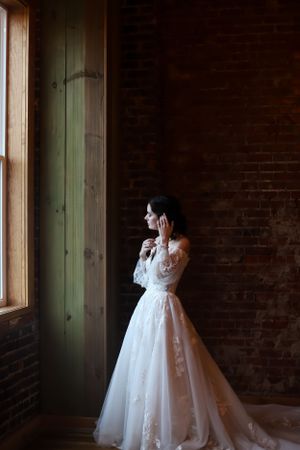 bridal portrait in brick building with low light