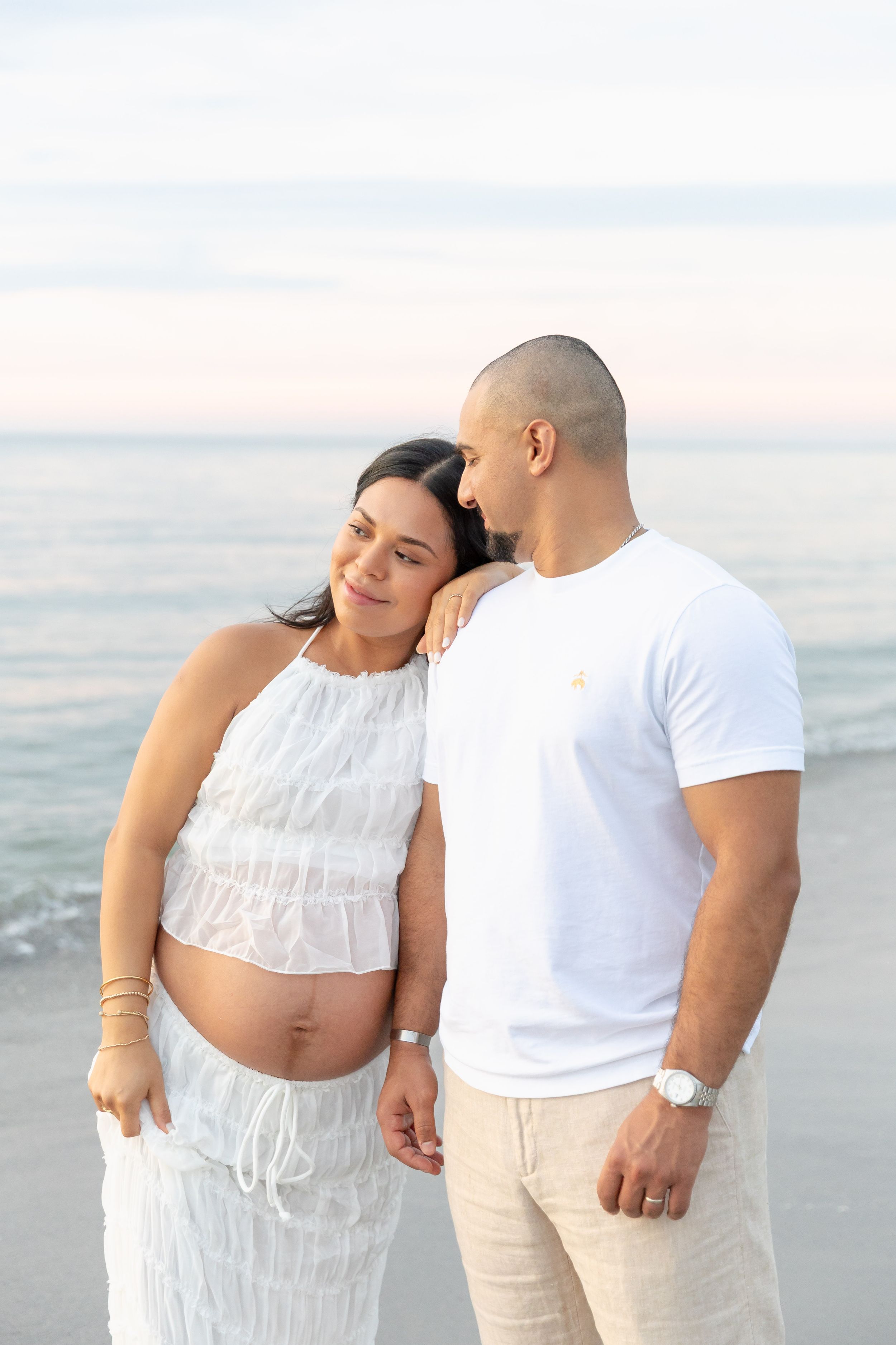 Couples Maternity Session on the beach during sunrise