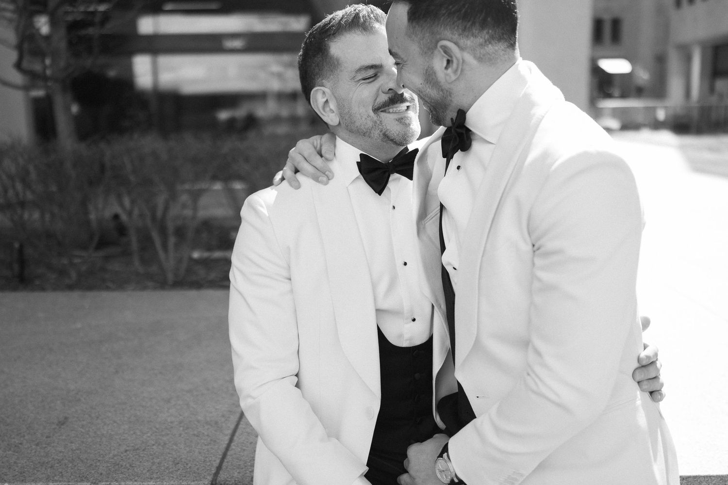 Luxury LGBTQ+ wedding portrait of two grooms at Four Seasons Montreal.