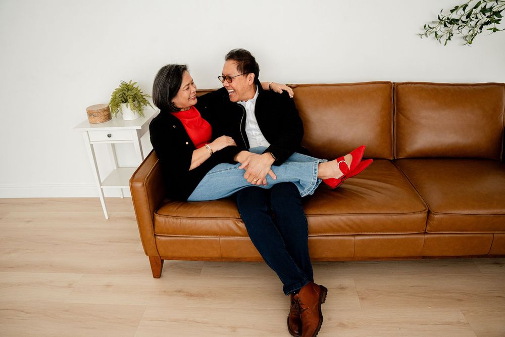 A sequence of photos showing someone falling backwards onto a brown leather couch in a staged dramatic fashion.