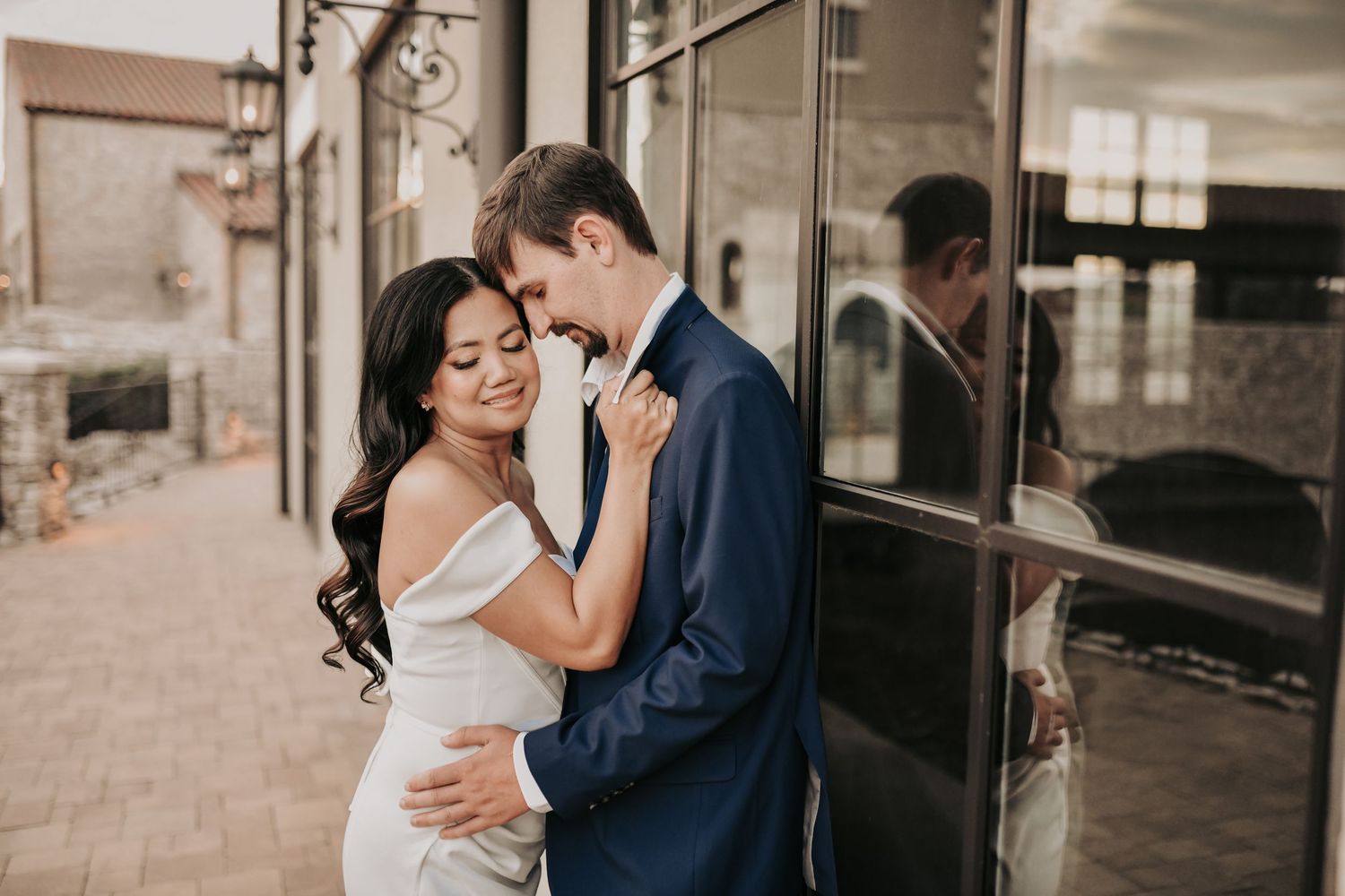 Bride-to-be in an elegant white dress with her fiancé during North Texas engagement photos