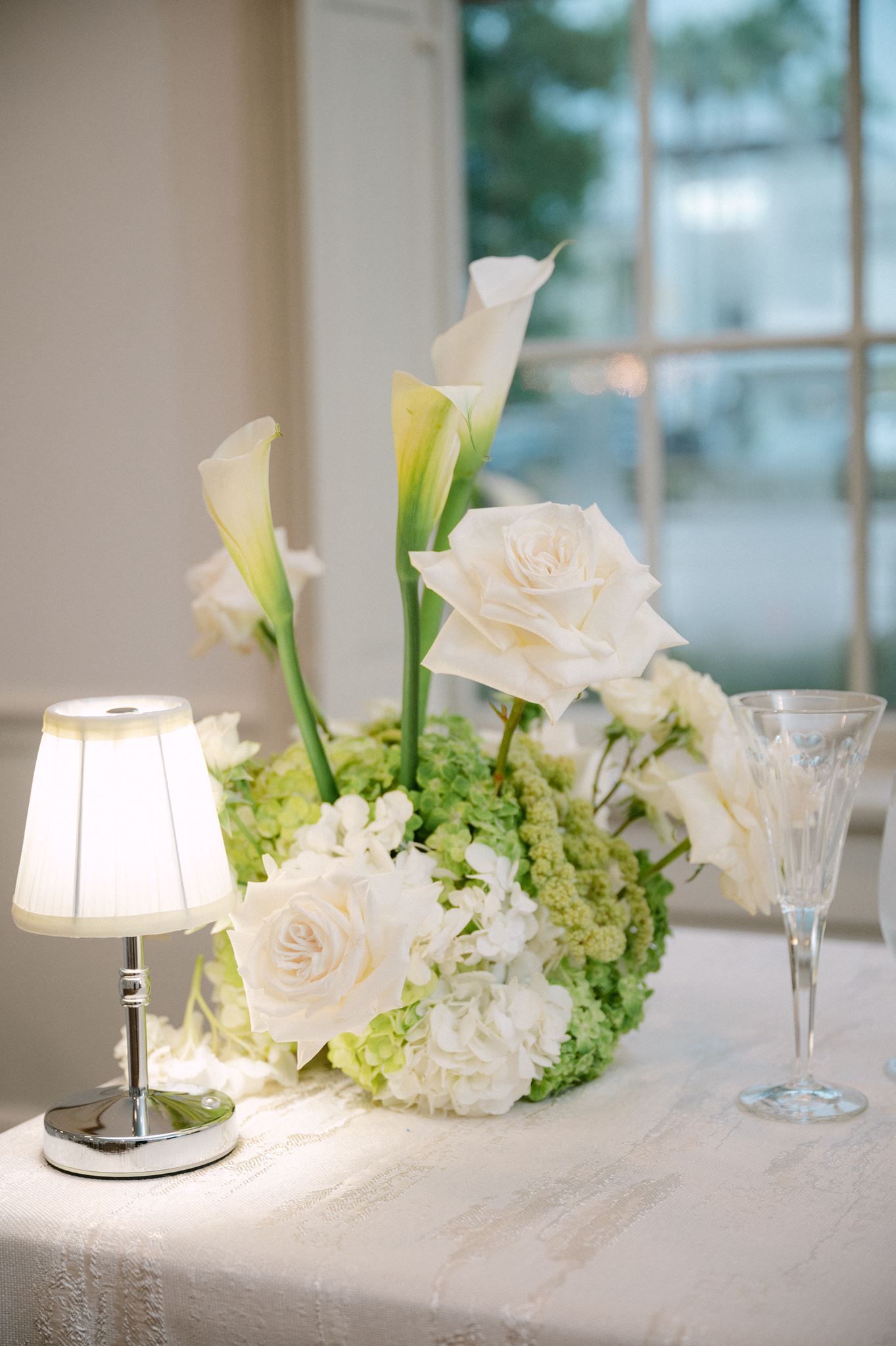 White calla lily centerpieces at wedding reception.