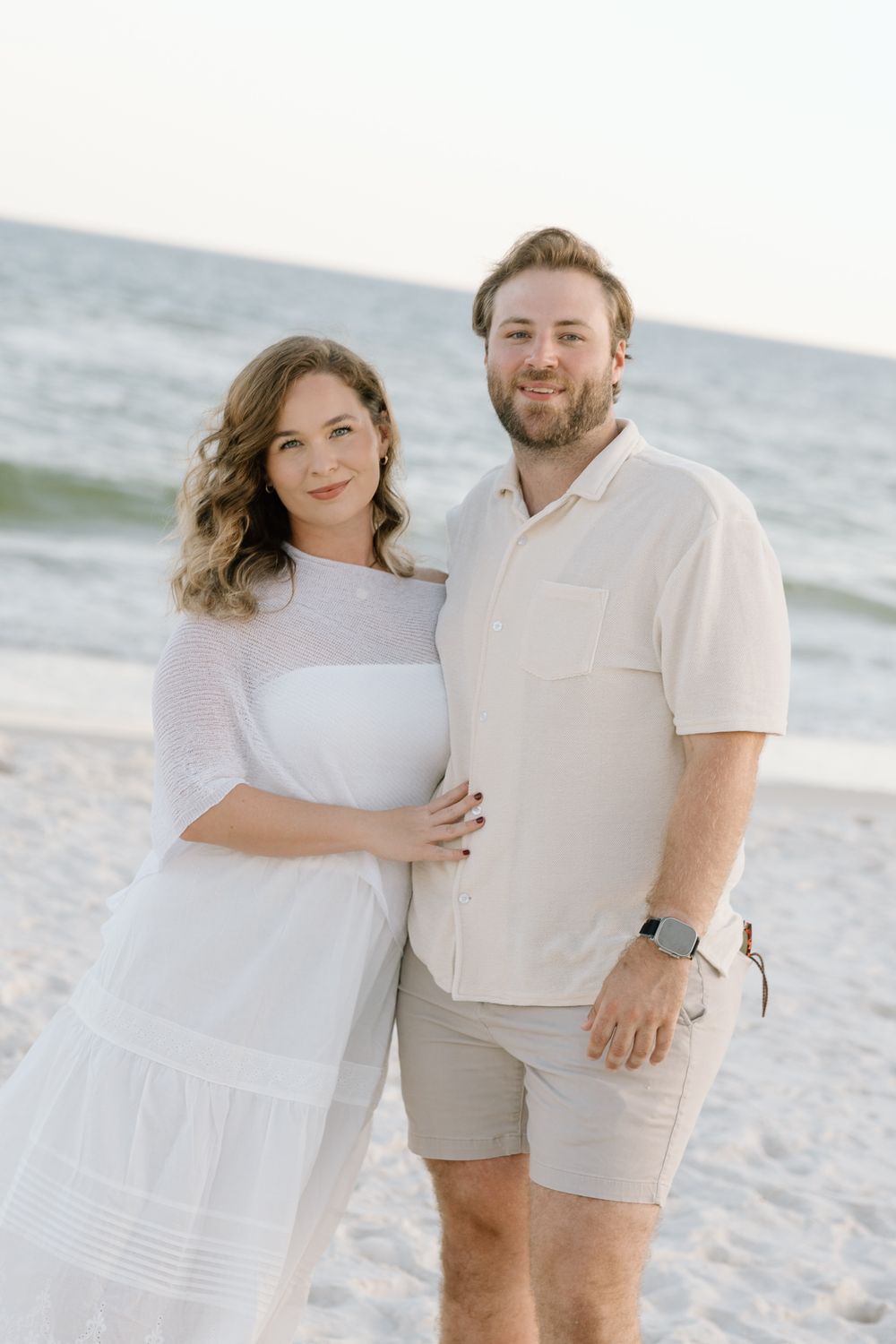 Couple shoot smiling on the beach in Gulf Shores and Orange Beach Alabama.