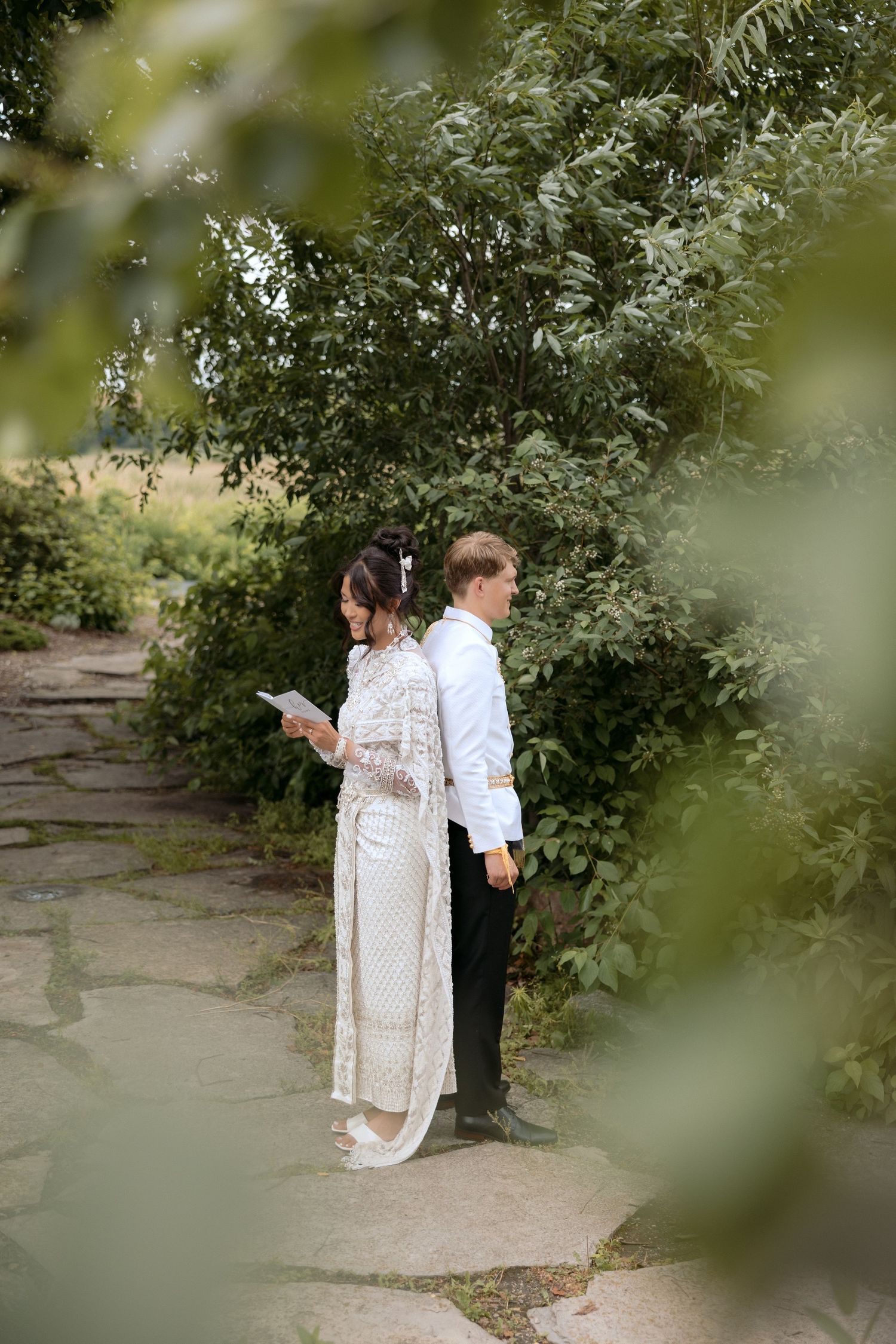 Bride & Grooms intimate first touch and vows in traditional Cambodian attire at the Millenium Gardens in Plymouth, MN.