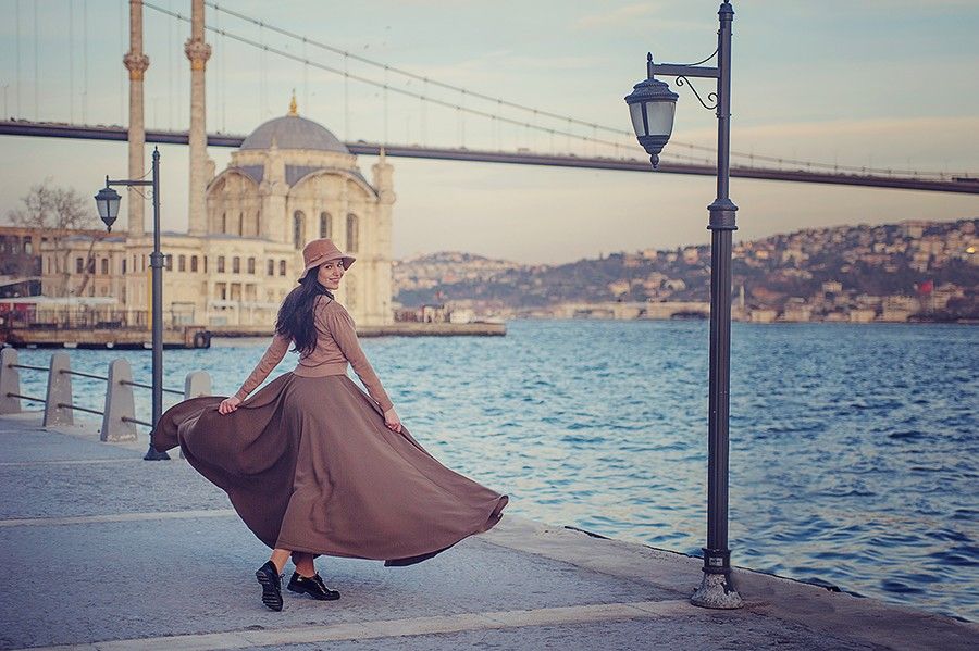 Destination lifestyle portrait in an urban waterfront setting photographed by Houston-based photographer