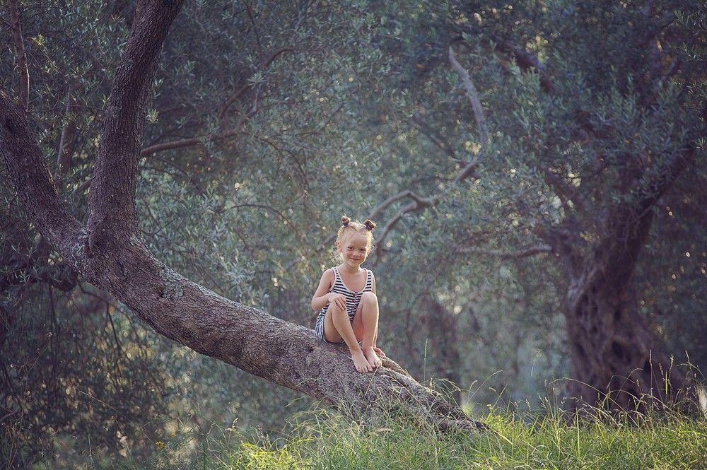 Fine art childhood portrait in nature photographed by Houston family photographer
