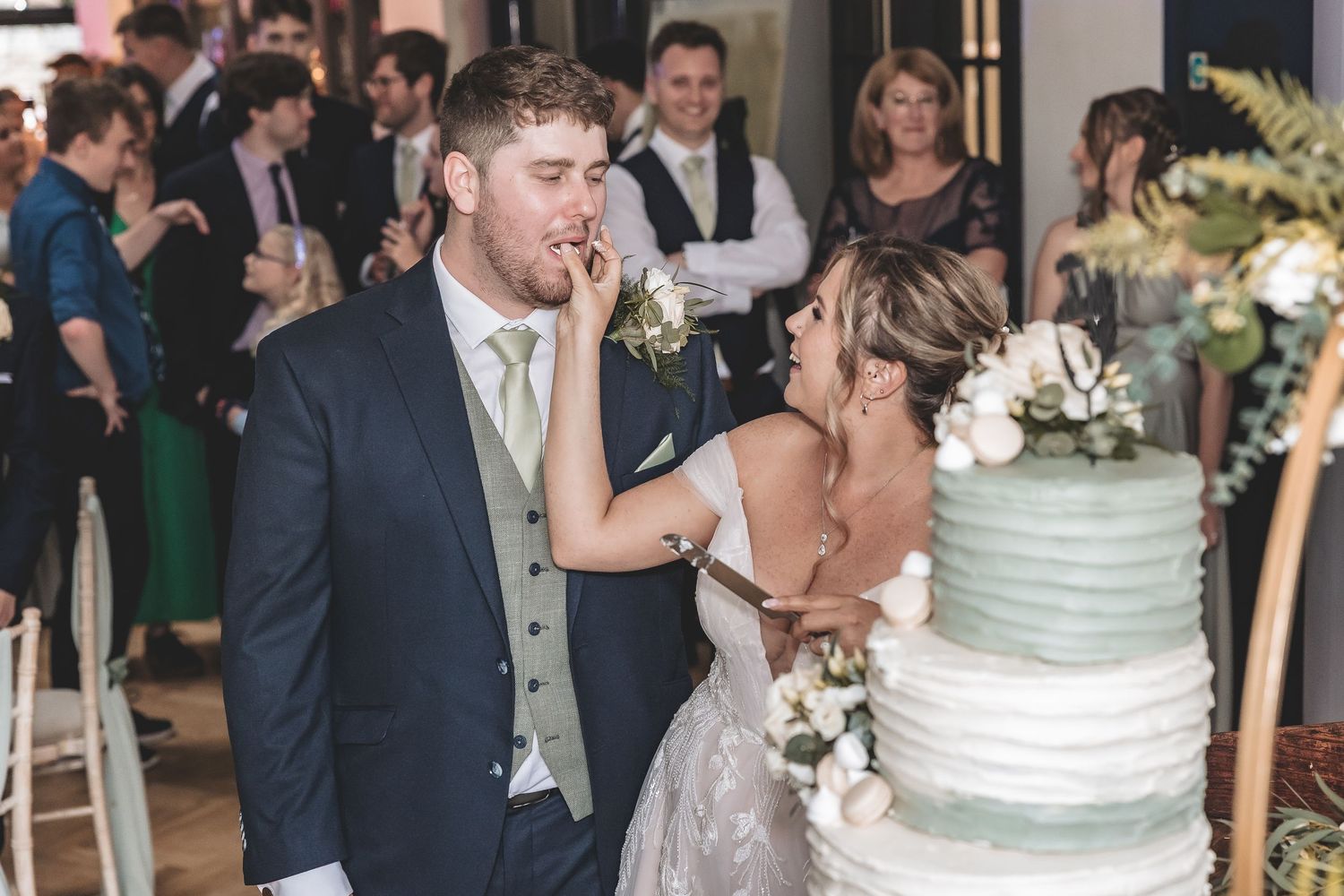 A fun cake cutting moment at a Nottinghamshire wedding venue.