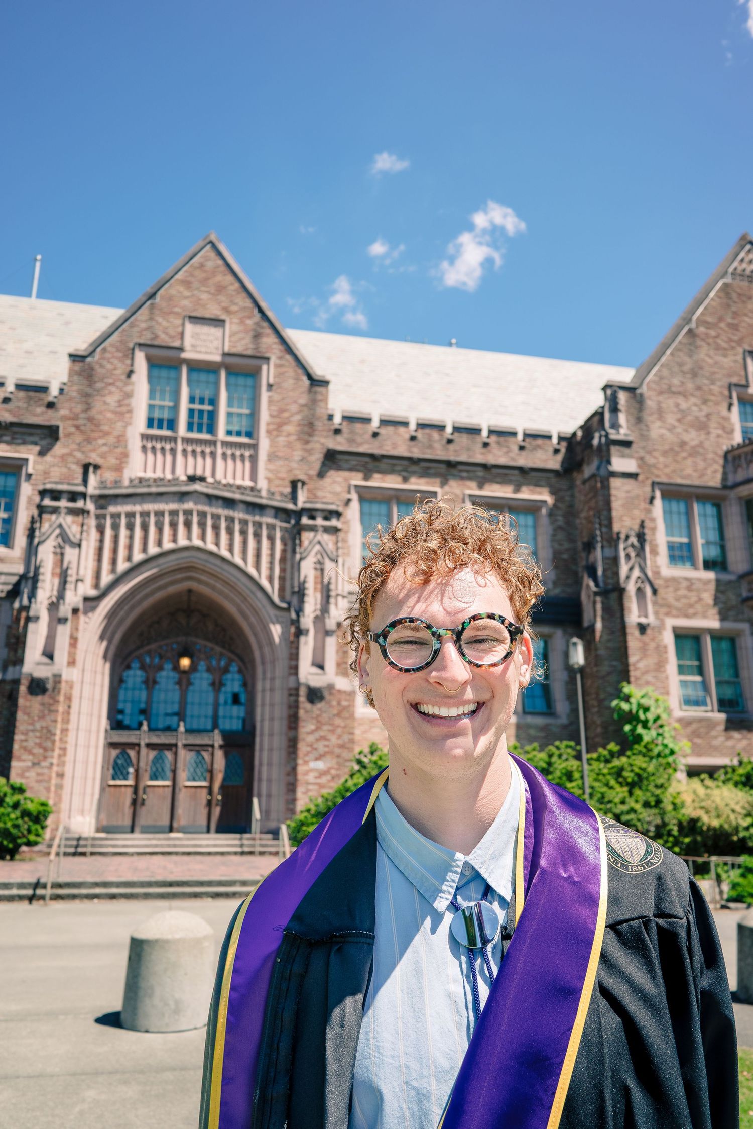 Close-up graduation portrait in front of Guggenheim Hall at the University of Washington