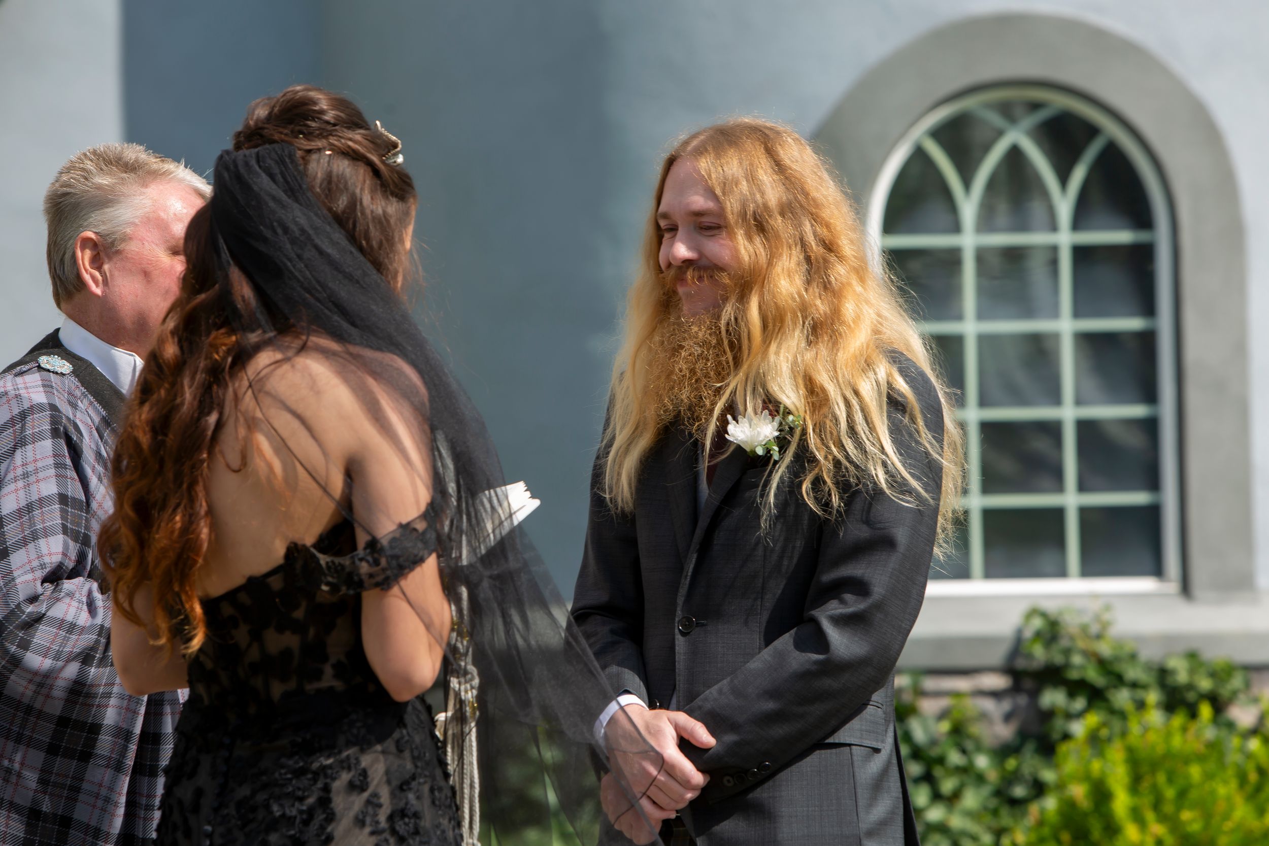 Milestones Studios LLC, Milestones Portraits wedding photography, Castle Gardens Kuna, Idaho groom smiling during ceremony