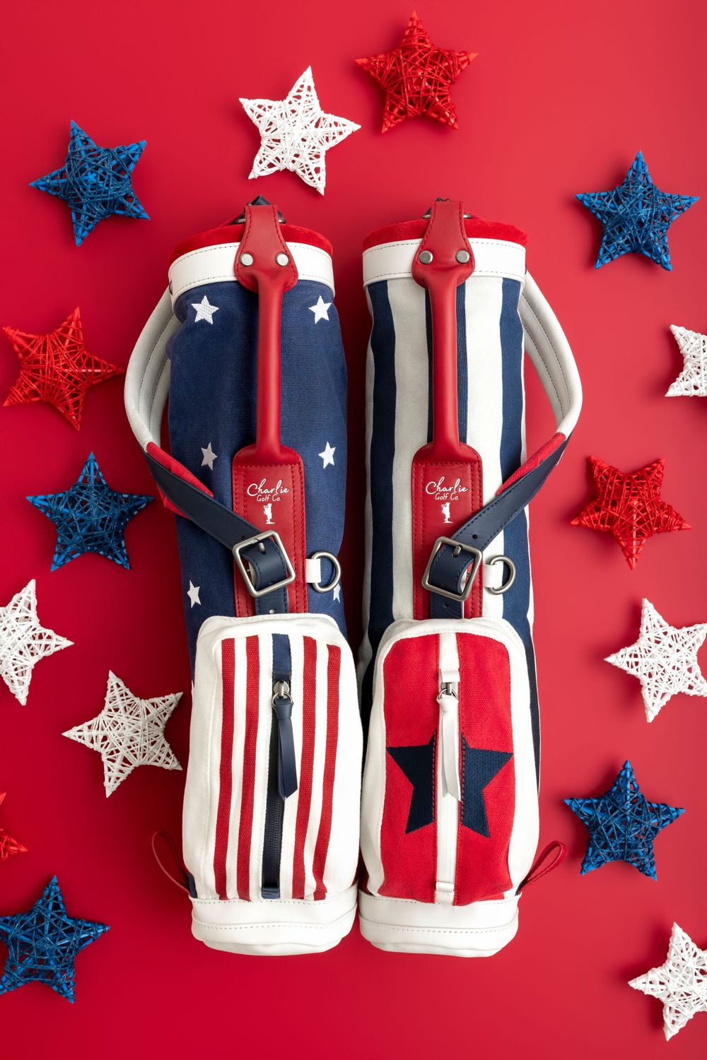 Patriotic red, white, and blue golf bags with stars and stripes design surrounded by decorative stars on red background.