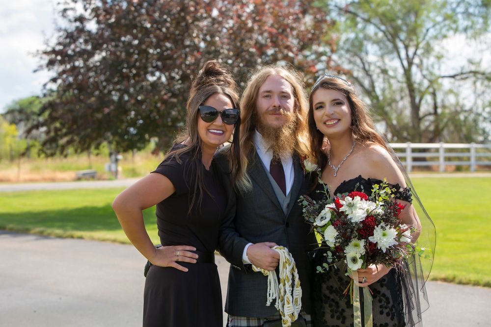 Castle Gardens Kuna Idaho ©Milestones Studios LLC bride and groom with kadie day of coordinatior wild bliss events
