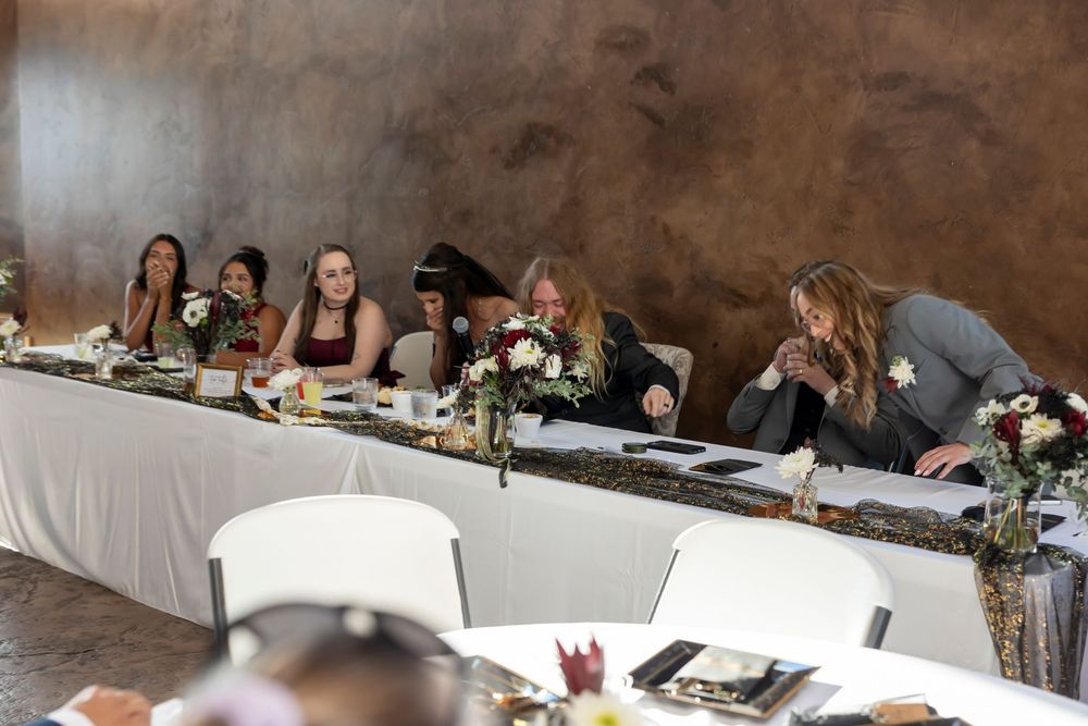 Head table during speeches at reception Castle Gardens Kuna Idaho ©Milestones Studios LLC