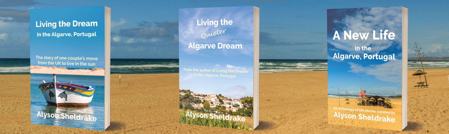 Three books about living in the Algarve, Portugal by Alyson Sheldrake, author, displayed on a sandy beach with ocean in the background.