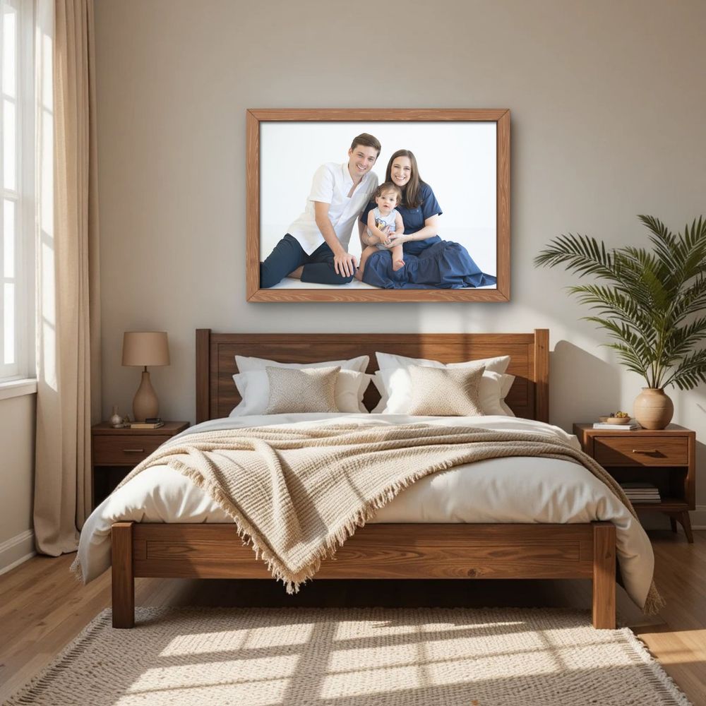 Family photos in houston hanging on the bedroom wall