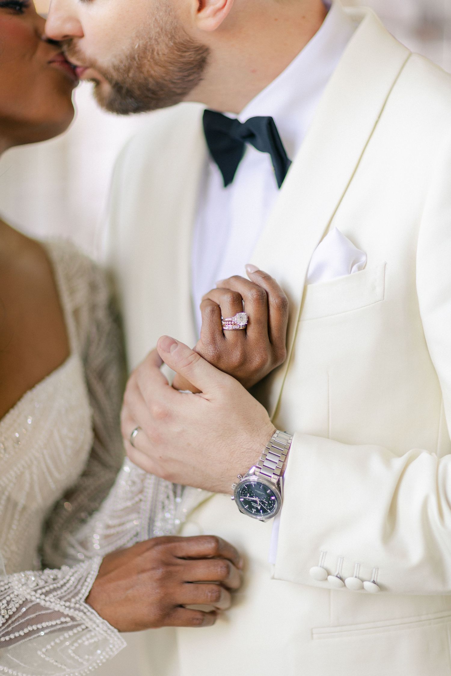 Bride and groom kissing, showcasing a pink diamond ring and luxury watch. - University Club of Chicago Wedding