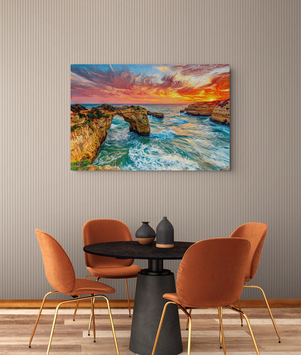 Canvas wall art of a vibrant ocean sunset with crashing waves and rocky cliffs, displayed in a modern dining room.