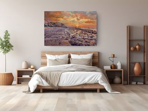 Bedroom with large sunset coastal landscape oil painting above wooden bed with neutral bedding and warm bohemian decor.