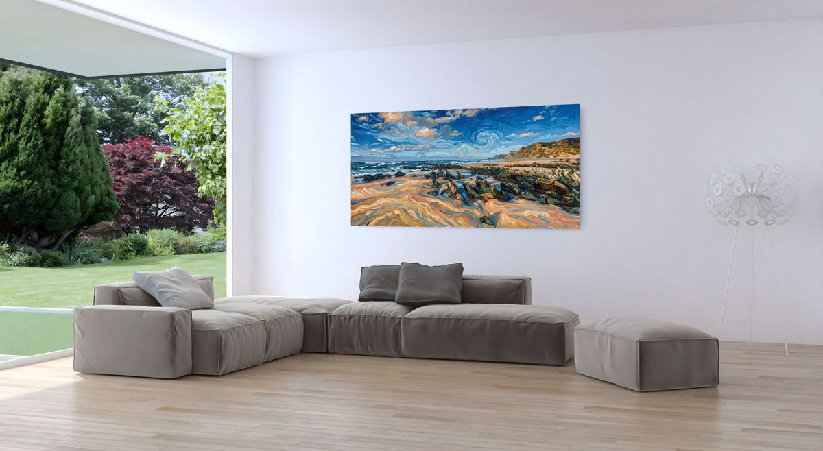 Large panoramic coastal landscape canvas print displayed on a white living room wall above a modern gray sectional sofa.