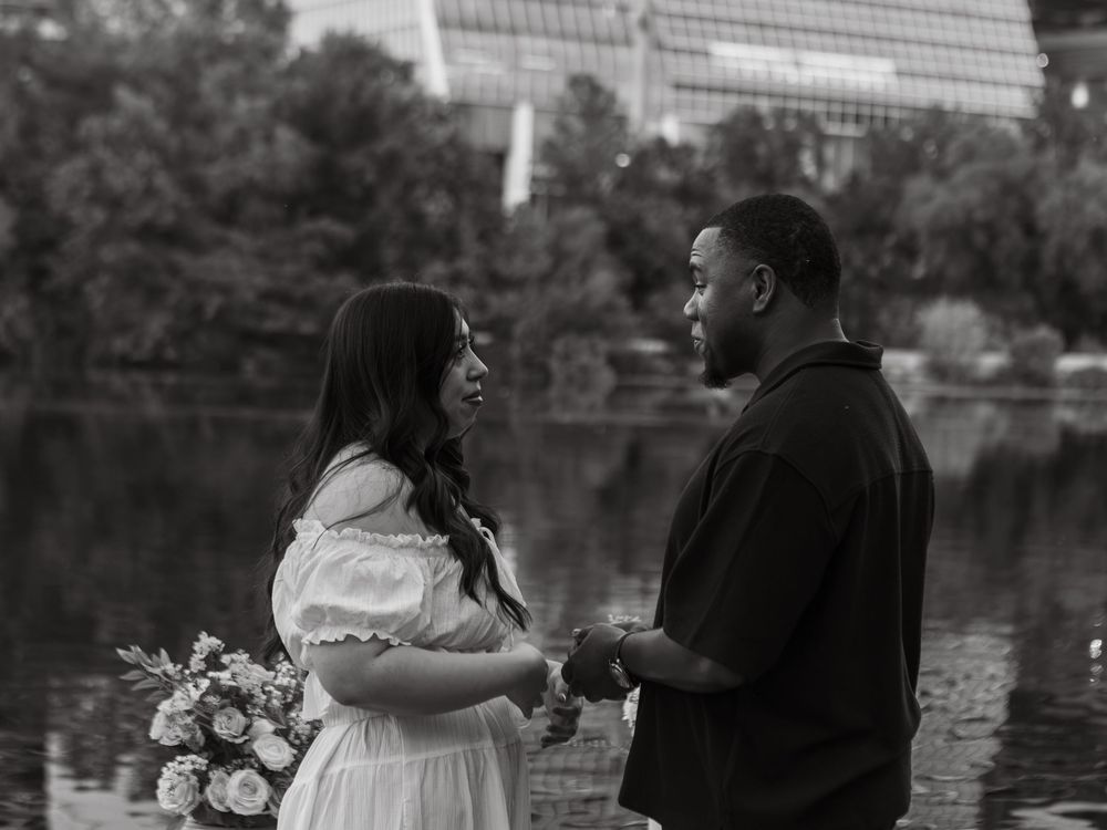 black and white photo of couple during proposal at butler metro park.