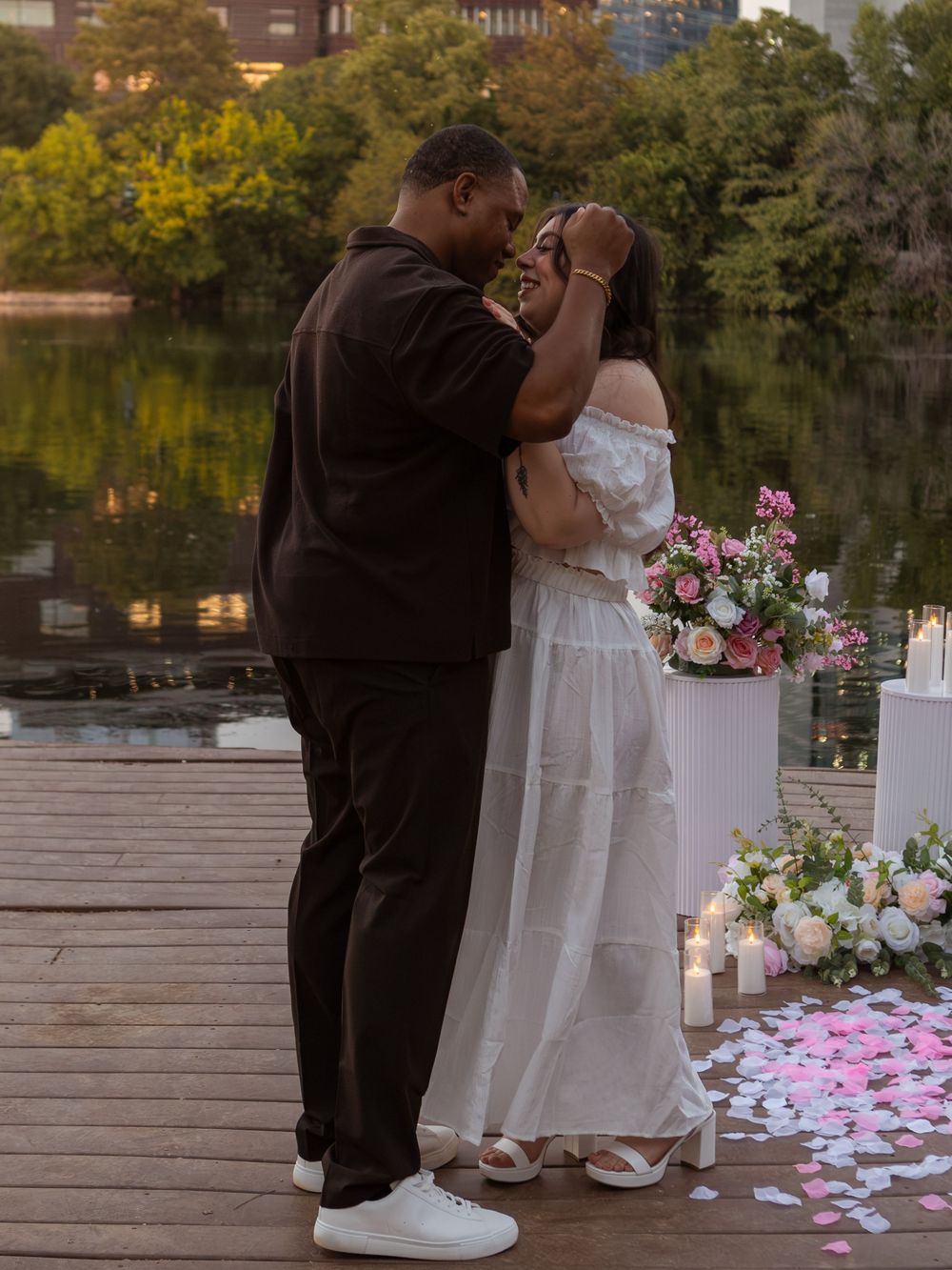 Couple gazing into eachother eyes during propsal at butler metro park.
