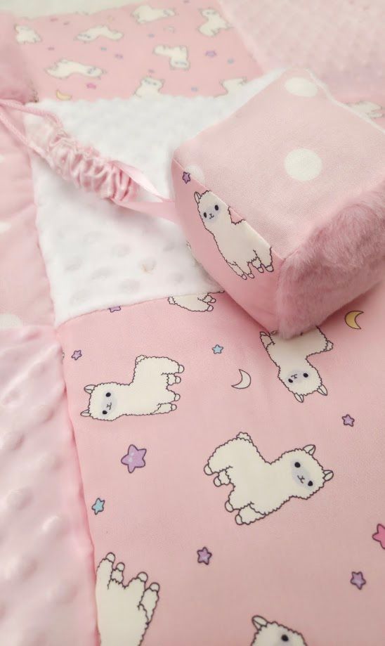 Pink baby blanket set with cute white llama and star print, featuring soft minky fabric and a matching pink plush cube toy.
