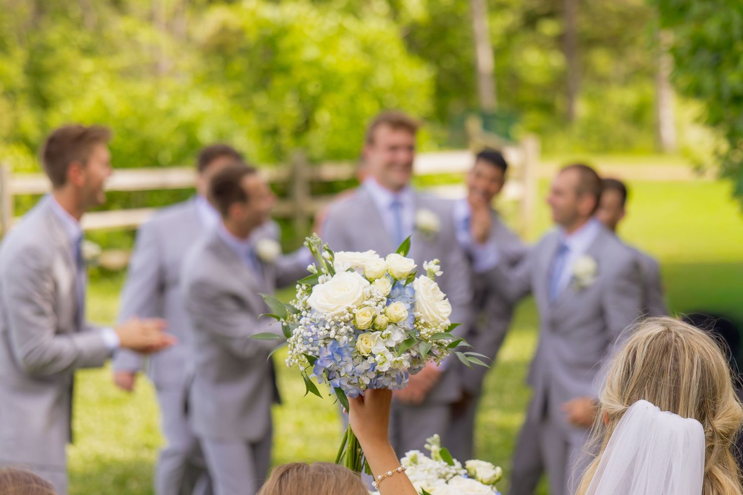Flowers in front of groomsmen
