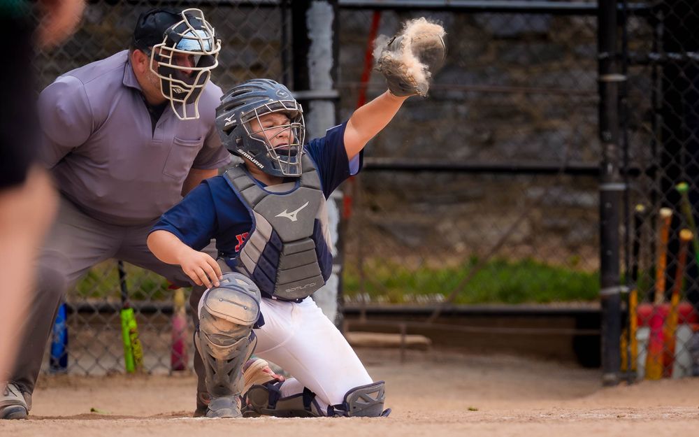 Hershey catcher reaches up for a throw at the plate in Summer Slam baseball, by Deanna Fox, SportsFox Photography based in Hershey PA