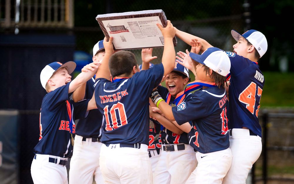 Hershey 12U lifts the trophy as the team celebrates the Summer Slam championship, by Deanna Fox, SportsFox Photography based in Hershey PA