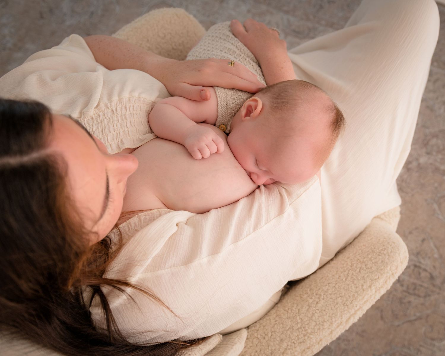 Natural, relaxed newborn breastfeeding photography session.