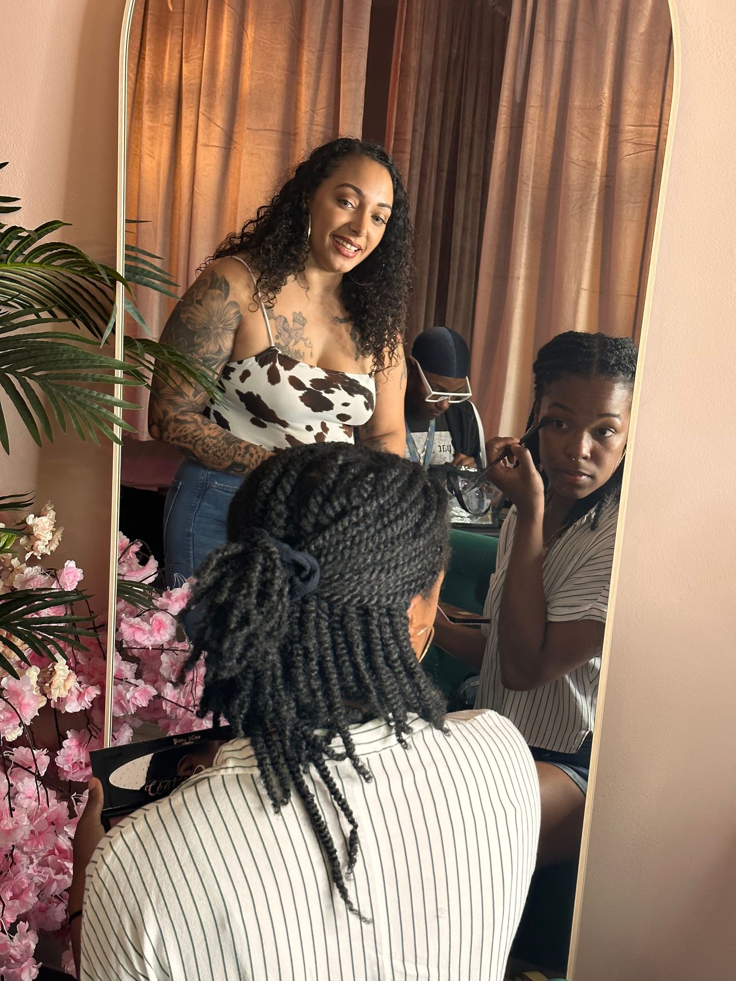Professional makeup artist applying camera-ready foundation before a photography session in Orlando.