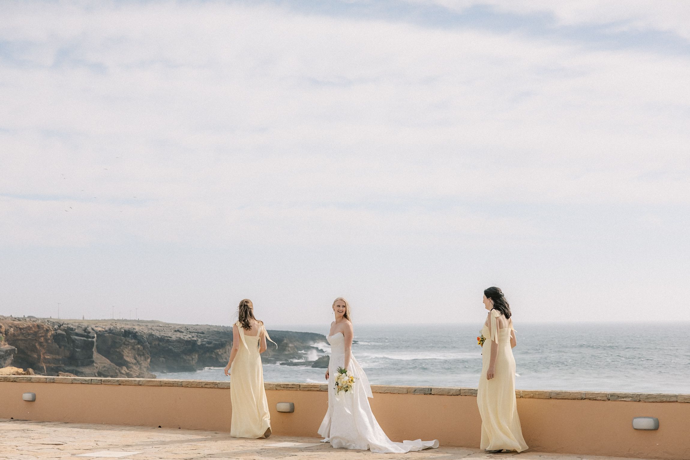 Fashion-inspired bridal party portraits at Farol Hotel before the wedding ceremony at Arriba by the Sea.