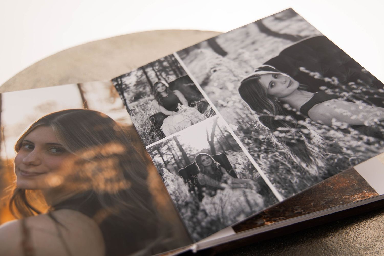 Open photo book displaying portrait photos of a young woman in color and black-and-white layouts.