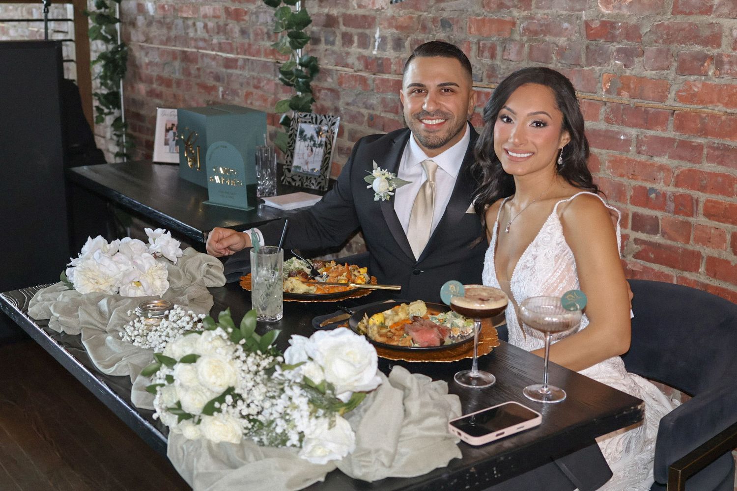 Bride and groom at a candlelit reception table during an intimate restaurant wedding in New Jersey