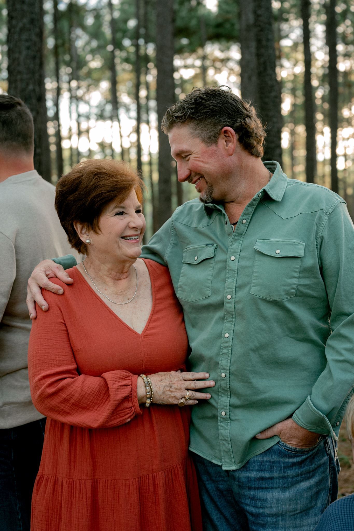 Mother and adult son sharing a laugh.