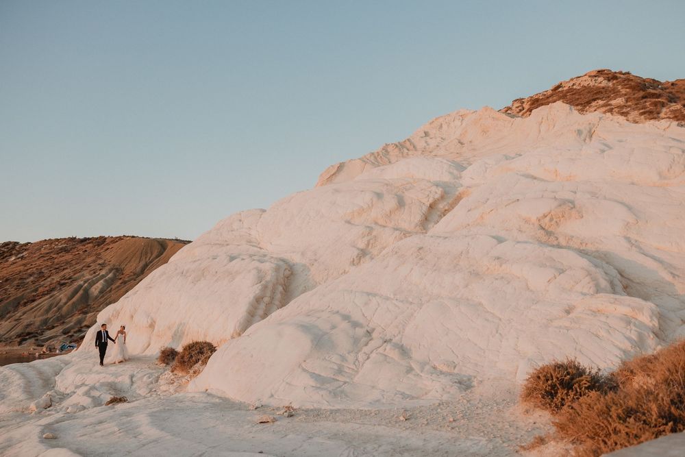 Giovanni and Cristina walk among the white cliffs of Punta Bianca in Sicily.