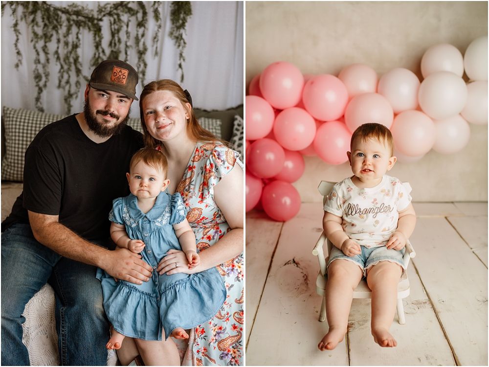 Family portrait with parents and toddler girl in studio, beside baby boy sitting near pink balloon arch.