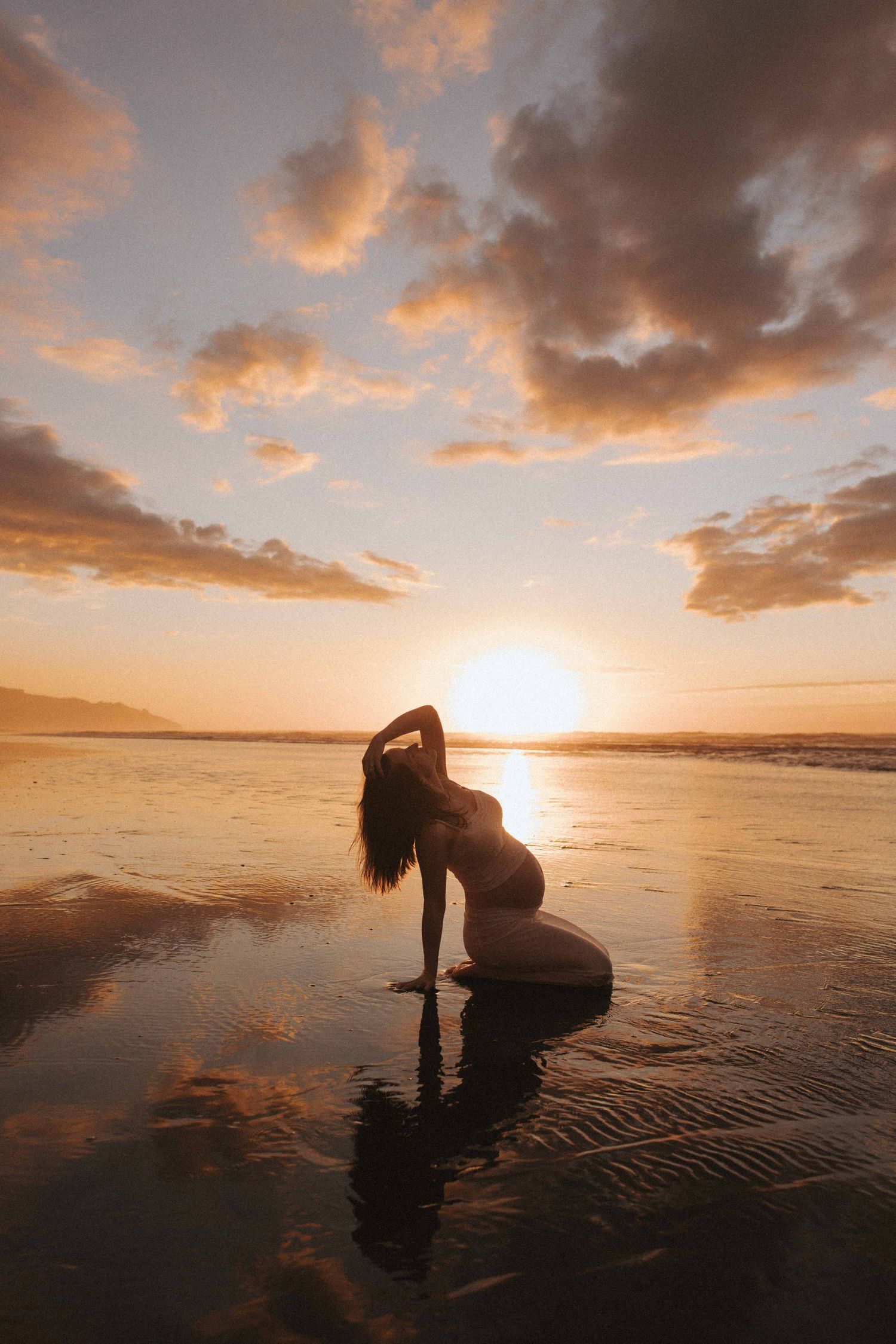 Maternity portrait of a photographer from Rotorua taken in Raglan, New Zealand by Nami Creative