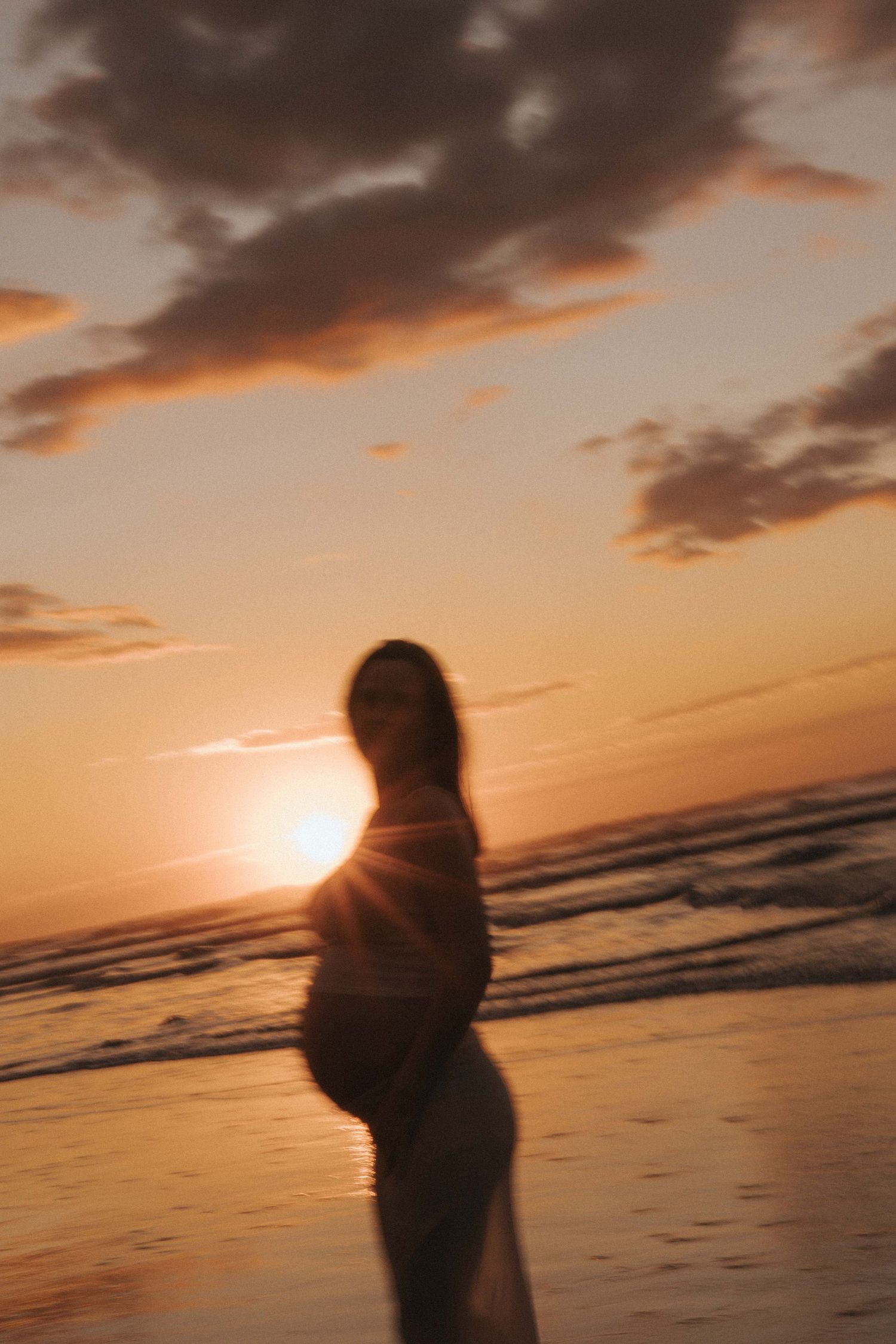 Pregnant woman at 35 weeks at her guided maternity session with Nami Creative in Raglan