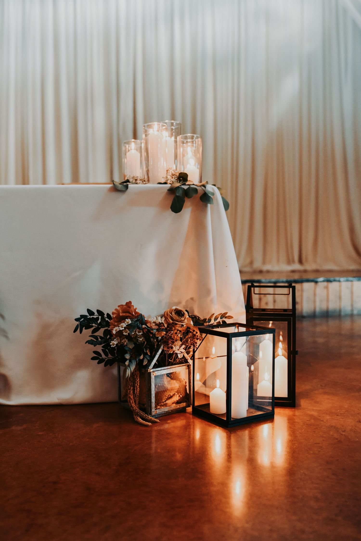 Gold place settings and loose greenery at elegant Texas ranch wedding