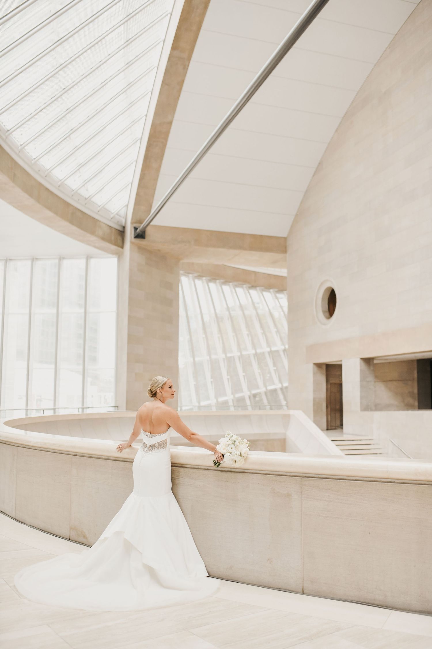 Elegant Dallas bride photographed beneath the architectural lines of the Meyerson Symphony Center