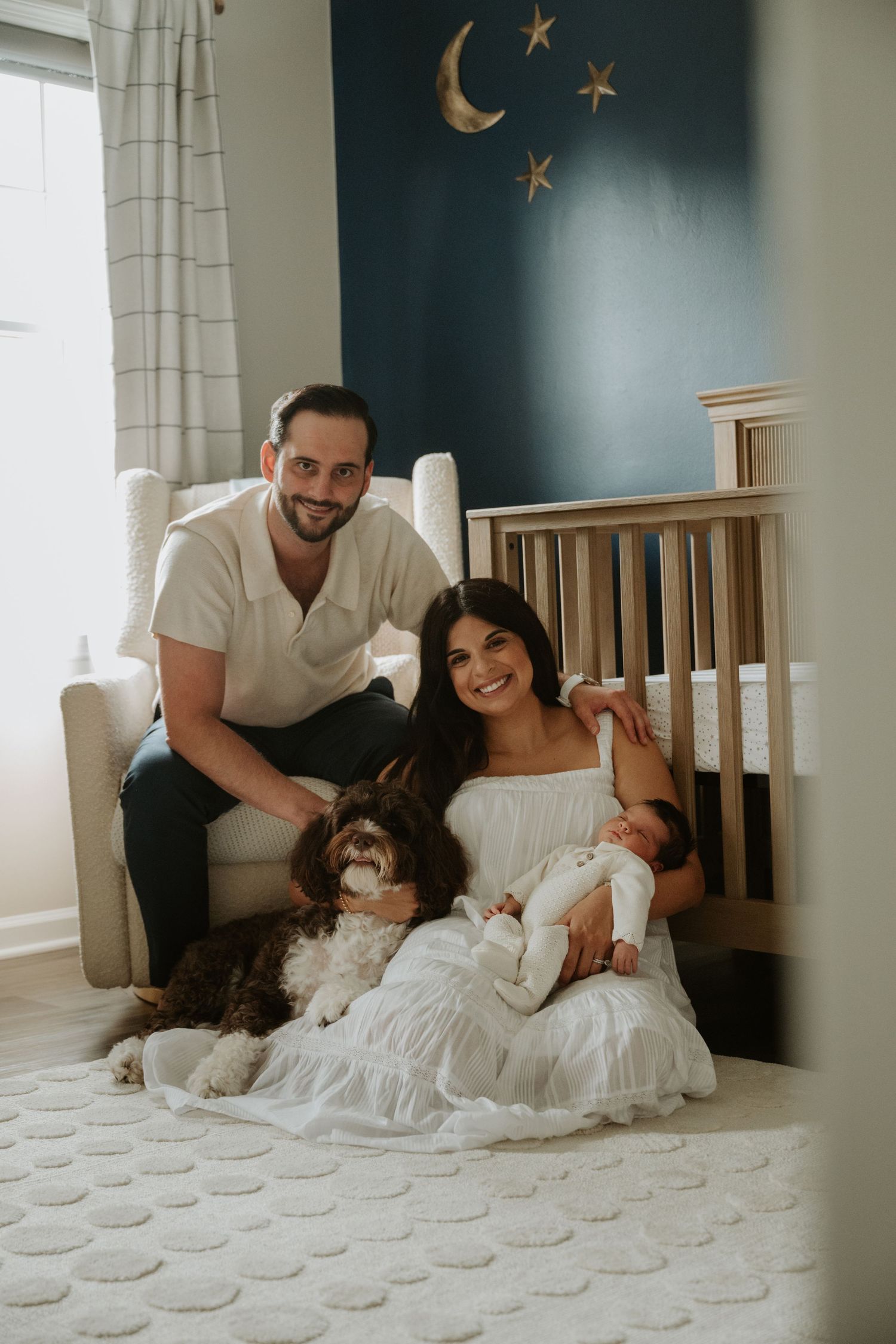Parents with their newborn baby during a relaxed in-home lifestyle newborn session