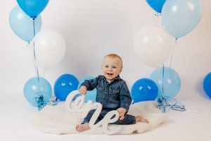 Adorable themed 1st birthday cake smash session in our Ridgefield, CT studio. Custom backdrops to celebrate your baby's big milestone!