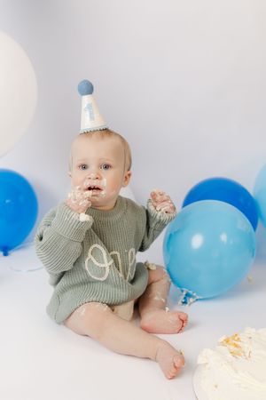 Adorable themed 1st birthday cake smash session in our Ridgefield, CT studio. Custom backdrops to celebrate your baby's big milestone!