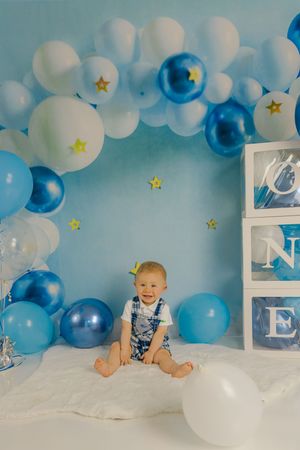 Adorable themed 1st birthday cake smash session in our Ridgefield, CT studio. Custom backdrops to celebrate your baby's big milestone!