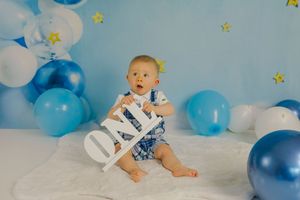 Adorable themed 1st birthday cake smash session in our Ridgefield, CT studio. Custom backdrops to celebrate your baby's big milestone!