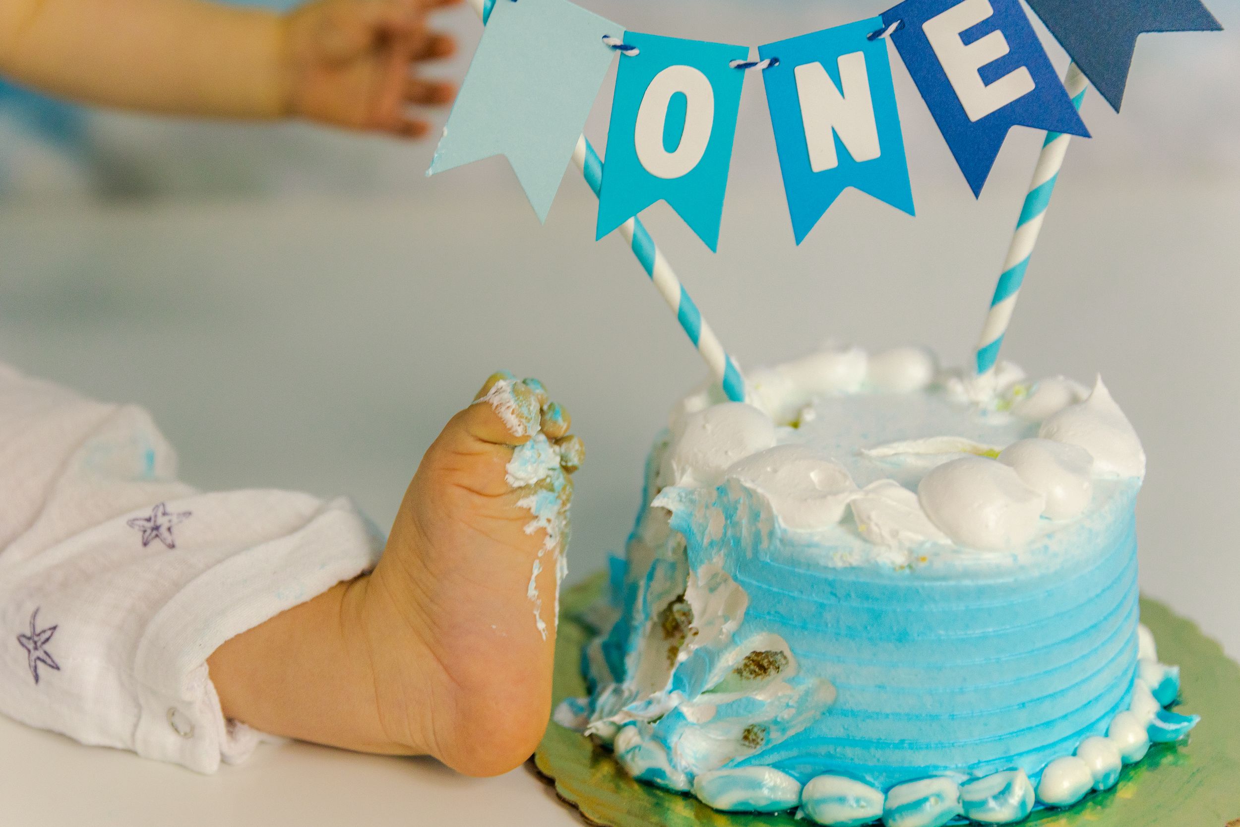 Adorable themed 1st birthday cake smash session in our Ridgefield, CT studio. Custom backdrops to celebrate your baby's big milestone!