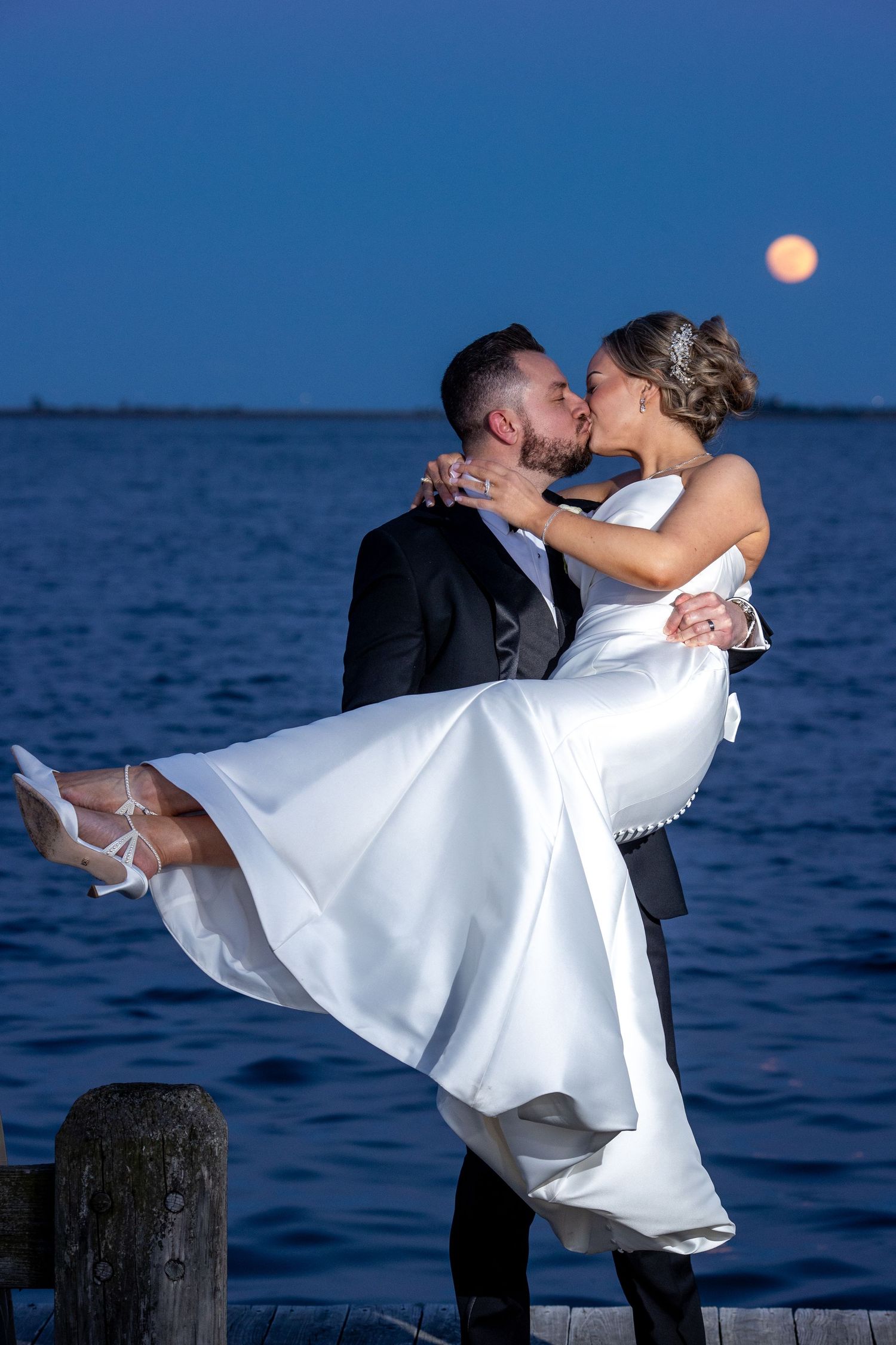 Bride and groom portrait at The Piermont in Babylon along Long Island's Great South Bay.